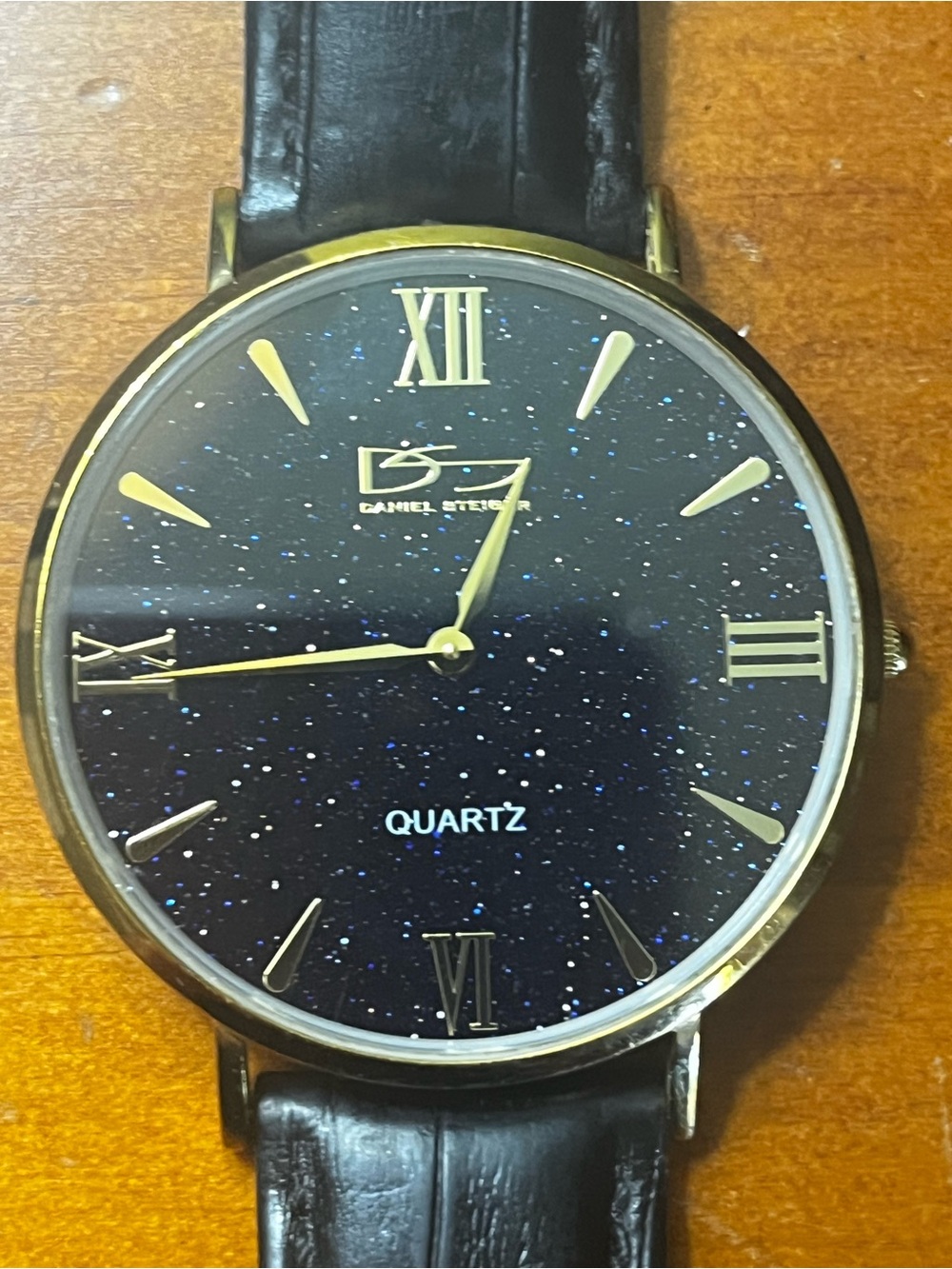 Black Starry Dial Quartz Watch with Gold Accents